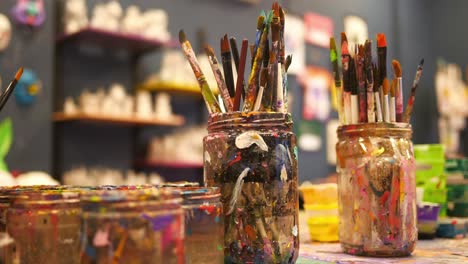 art supplies and paint in jars