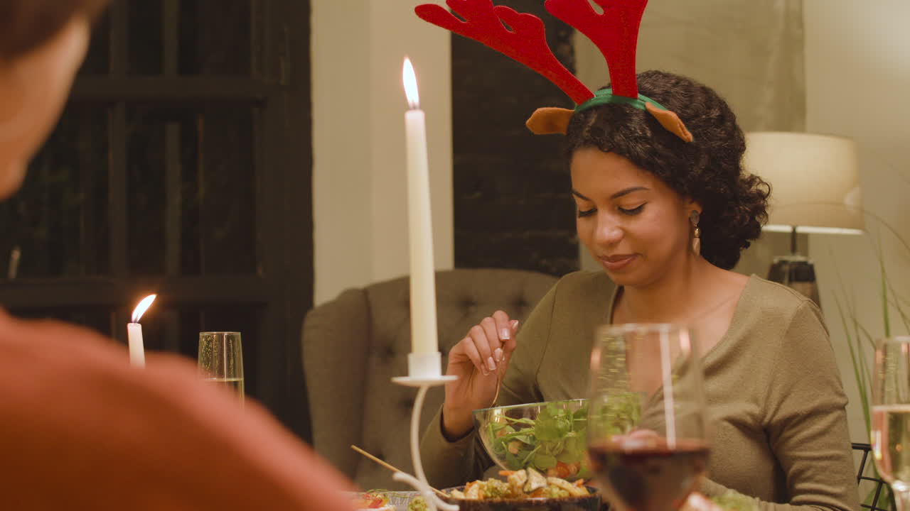 Friends eating dinner on Christmas time