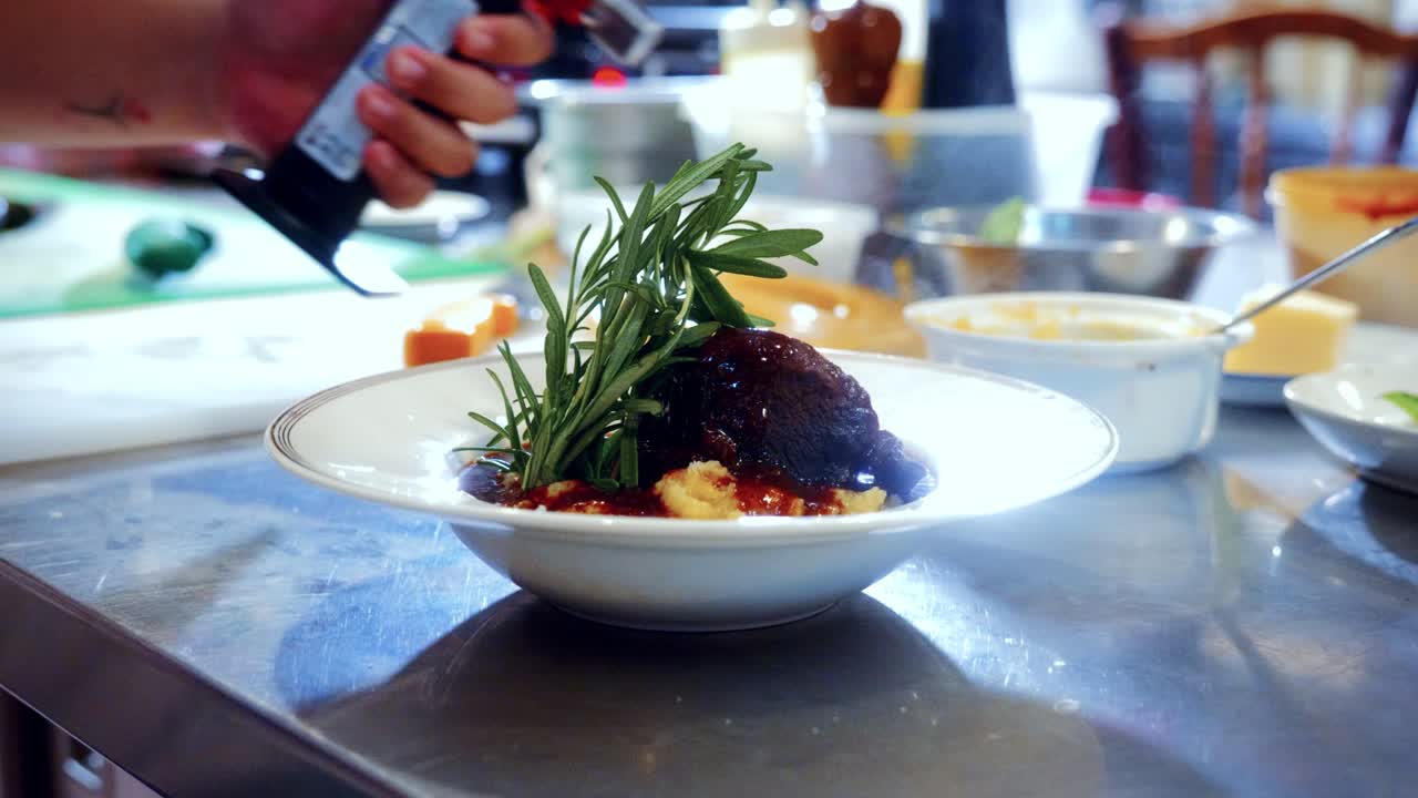 Authentic Italian food making process in traditional Italian restaurant, of an Italian beef stew with mashed potatoes called Spezzatino di Manzo
