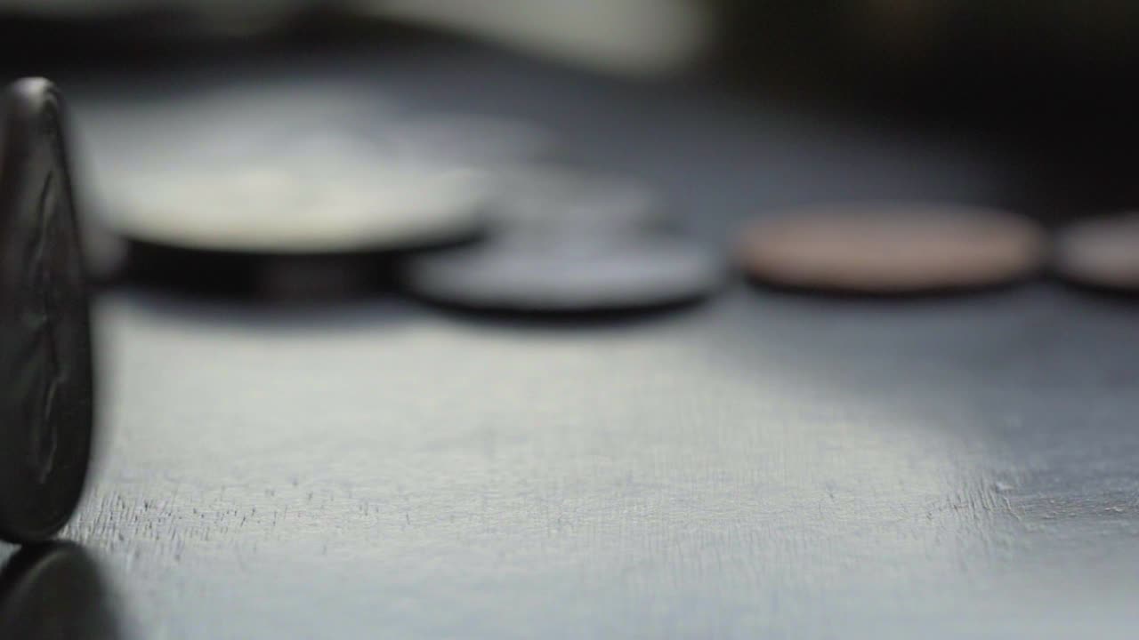 Close-up of Coins on a Dark Surface