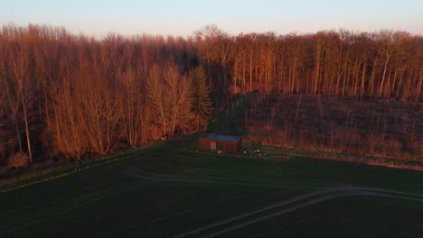 Isolated-Eco-Friendly-And-Sustainable-Cabin-In-Belgium,-Aerial-Shot