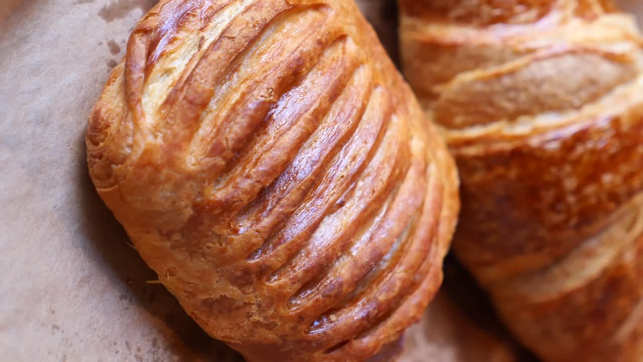 Close-up of baked pastries on parchment paper