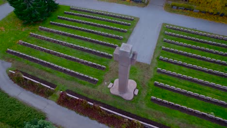 a giant stone cross being filmed with a drone