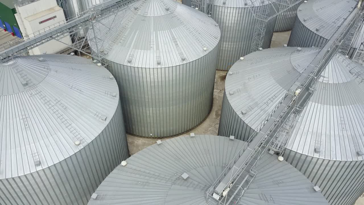 Grain elevator in agricultural zone. Row of granaries for storing wheat and other cereal grains