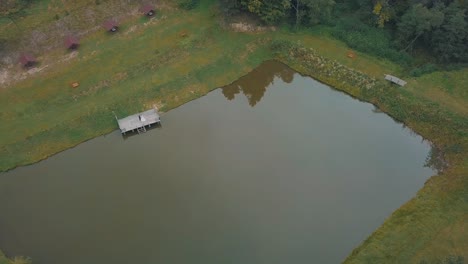 Groom-with-bride-near-lake-in-the-park.-Wedding-couple.-Aerial-shot