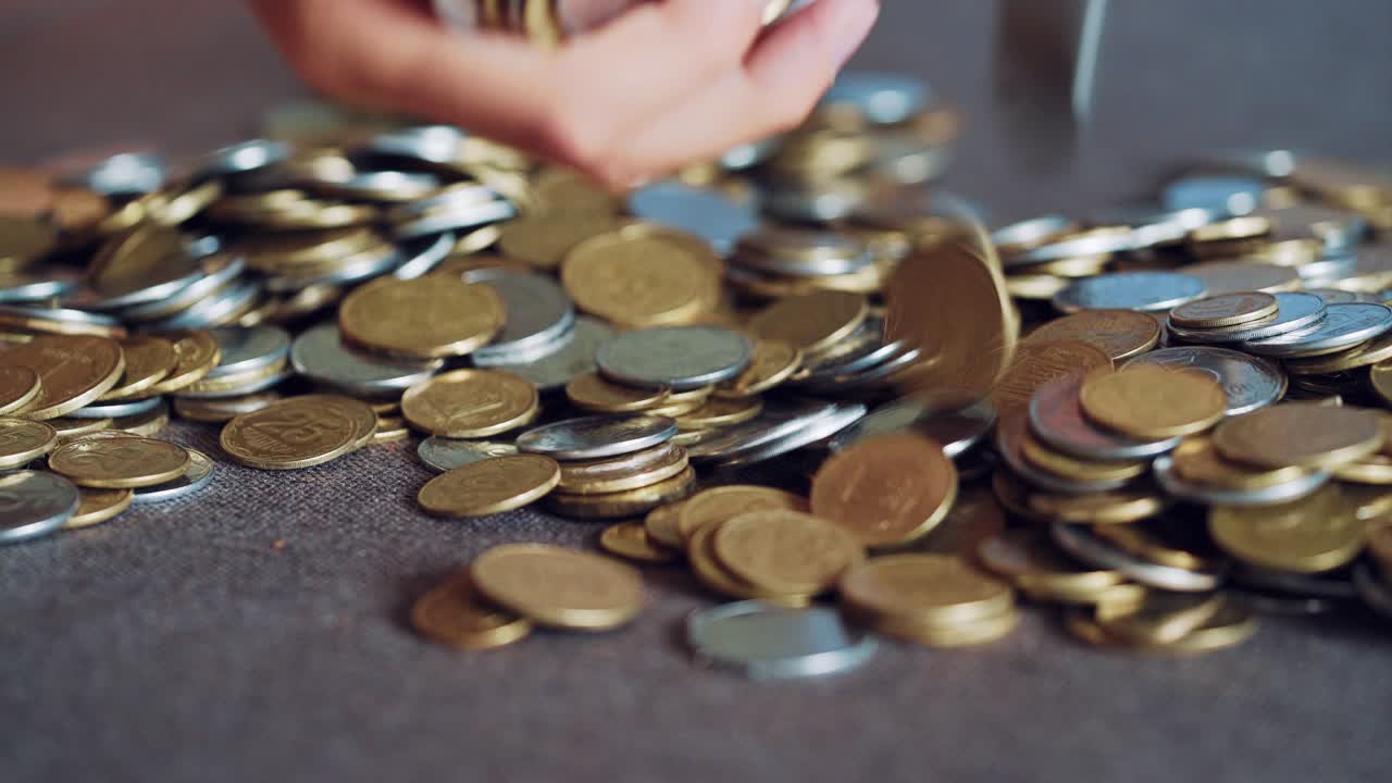 Coins in hands. Money concept.