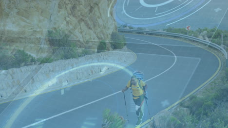 hiker with trekking poles on mountain road with futuristic data animation over