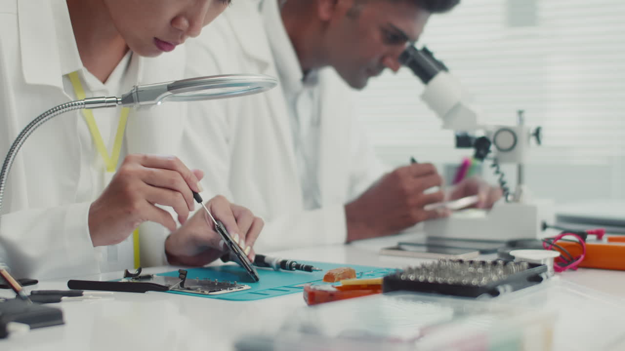 Service Specialists Repairing Components of Digital Devices