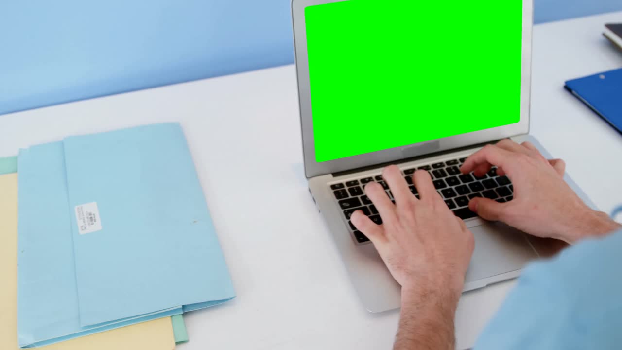 Physiotherapist using laptop