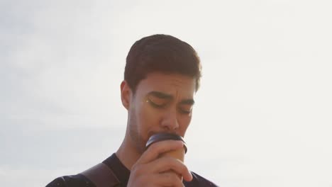 young man drinking coffee