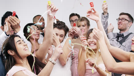 bridal party shooting poppers slow motion wedding photo booth series