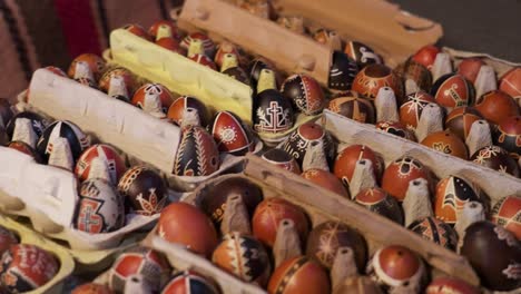 Multiple trays of intricately painted traditional Hungarian Easter eggs displayed for sale
