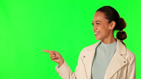 pantalla verde, rostro de mujer y mano apuntando