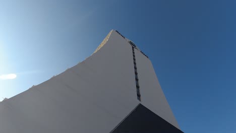 facade of a hotel in calpe alicante spain, bright blue skys and warm morning