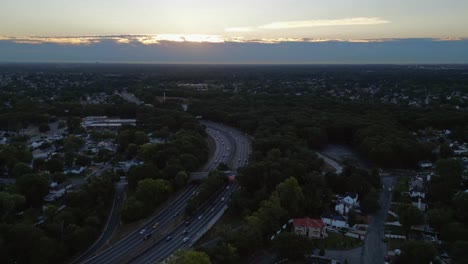an aerial time lapse of a highway at sunrise