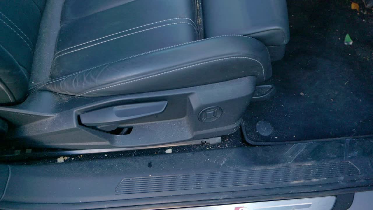 Very dirty drivers seat carpet gap suv interior - truck pan left to right