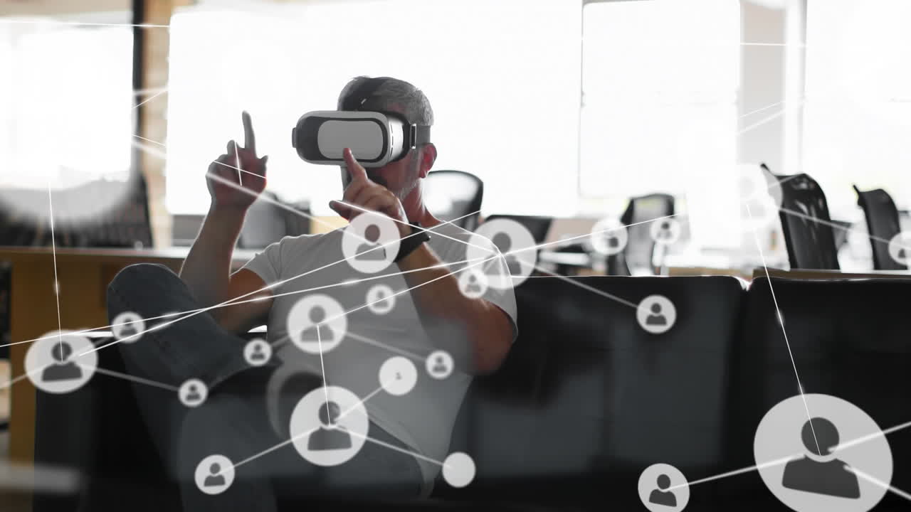Animation of networks of connections and businessman wearing phone vr headset