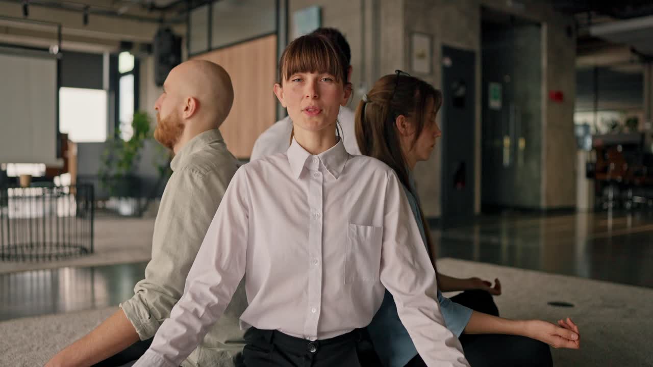 Business Team Meditating in Office