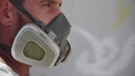 graffiti artist standing with protective mask 4k