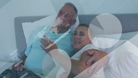 animation of financial data processing over senior caucasian couple