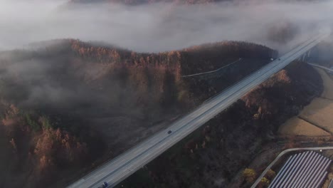 a foggy autumn highway scene