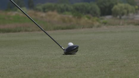 hitting a golf ball. close up. slow motion