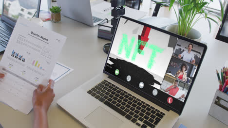 African-american-businesswoman-using-laptop-for-video-call-with-diverse-business-colleagues