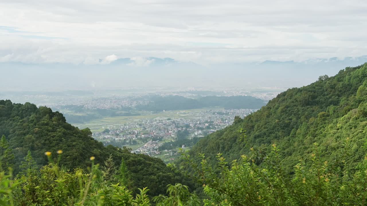 Kathmandu Valley and Himalayas Mountains Scenery, Forest Landscape in the Foothills and Kathmandu Cityscape with the City Behind