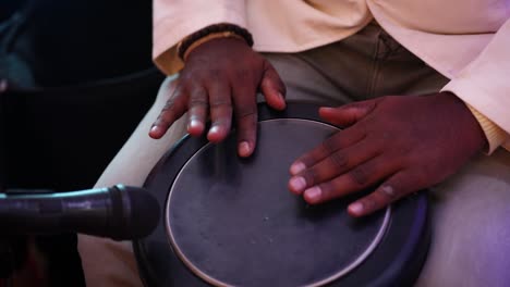 close up of performer hands playing typical drum at concert. gimbal