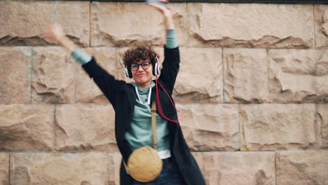 happy woman dancing in the city
