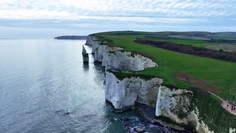 aerial view flying along the steep white cliffs of old harry rocks