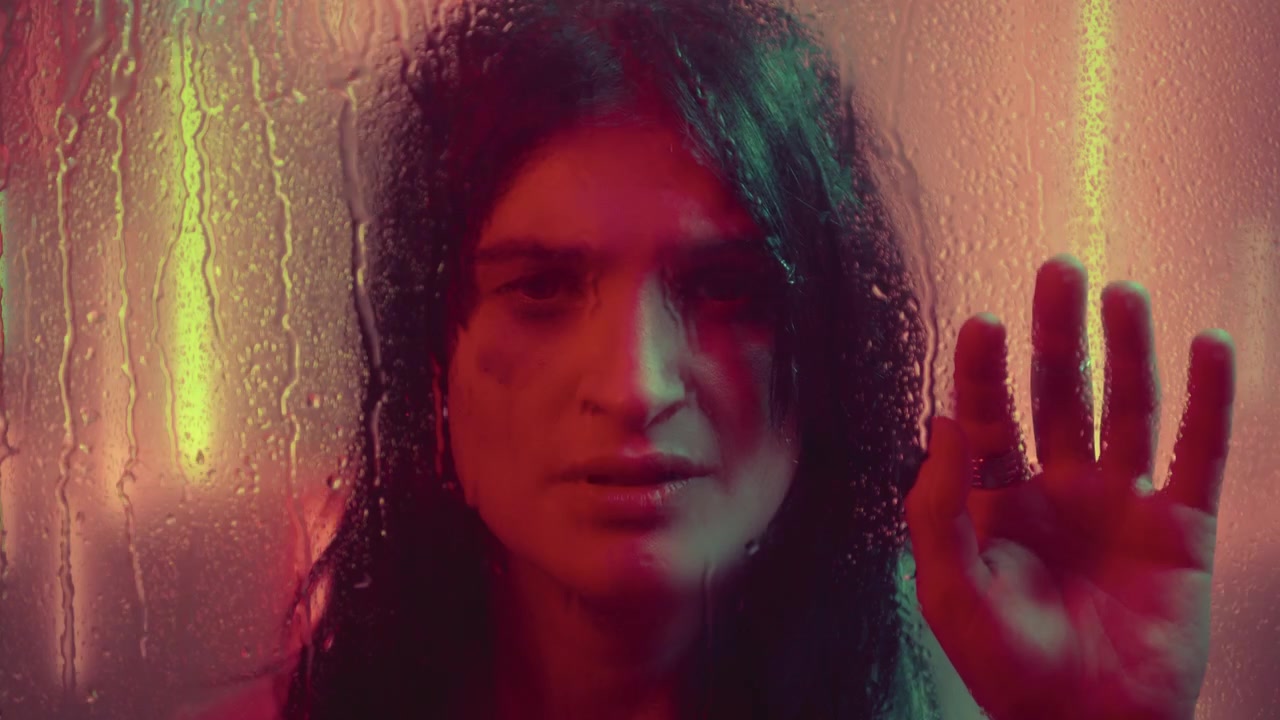 Crying Woman Posing Behind Wet Window