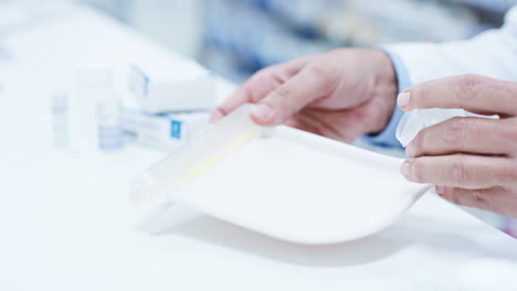 filling up containers for his patients