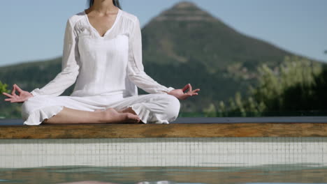 -Calm-woman-doing-yoga-poolside