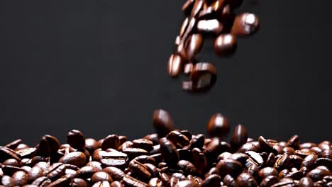 Video showcasing coffee beans against a dark background, emphasizing texture and richness, shot