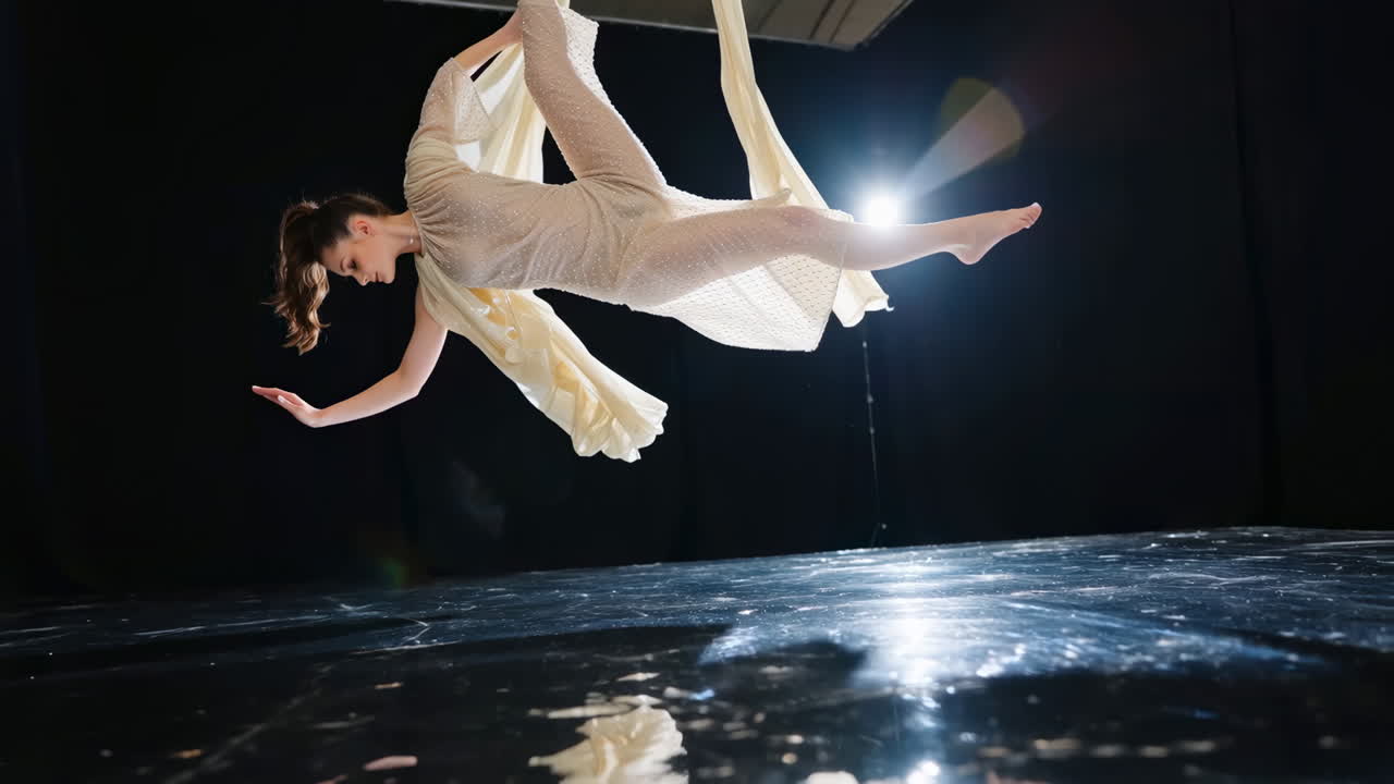 Woman performing aerial silks acrobatics