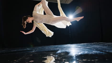 woman performing aerial silks acrobatics