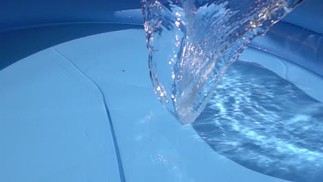Water-slowly-falling-on-a-pool