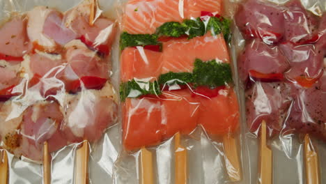 marinated chicken and salmon skewers