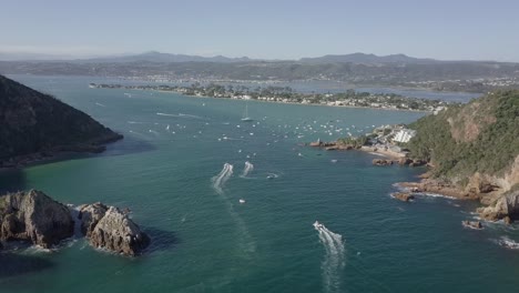 aerial: busy waterway of knysna heads and lagoon on a sunny day