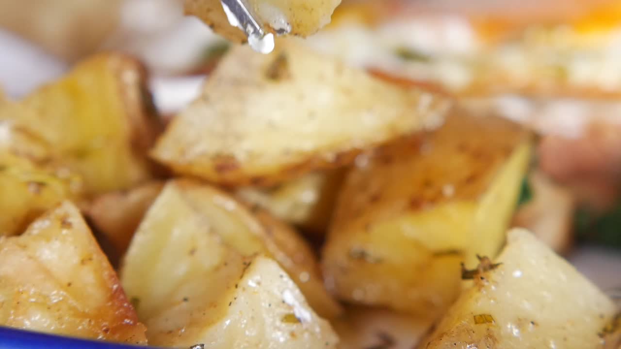 Roasted potatoes on a fork