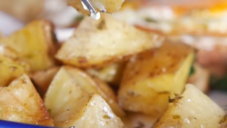 roasted potatoes on a fork