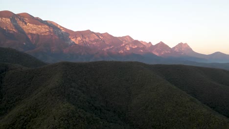 Wide-drone-shot-of-the-mountains-at-sunset-in-Monterrey,-Mexico