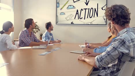 team of executives looking at the presentation in the conference room