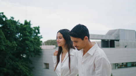 sensual man embracing woman rooftop. affectionate couple enjoying romantic time
