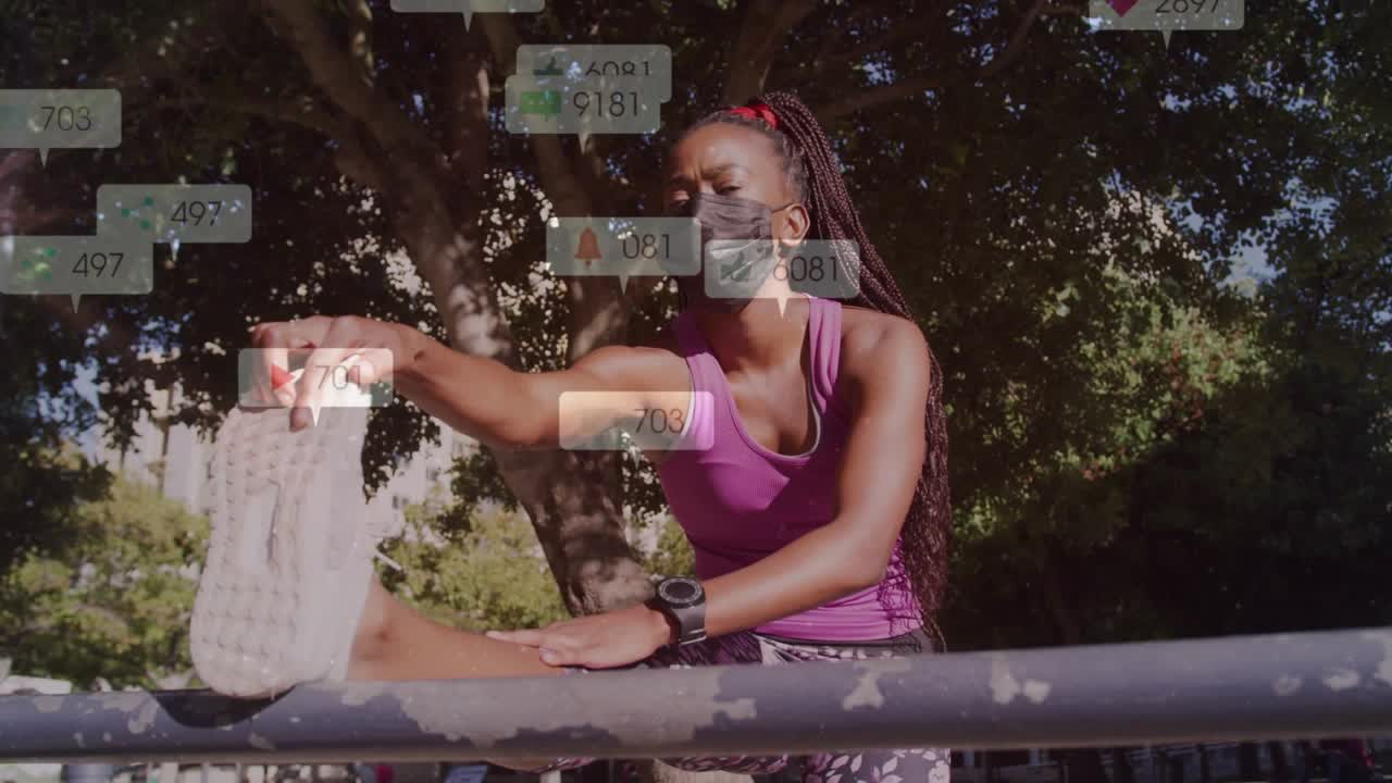 Appassionato di fitness che arriva alla ringhiera, riscaldando i muscoli posteriori della coscia tra metriche sociali fluttuanti.