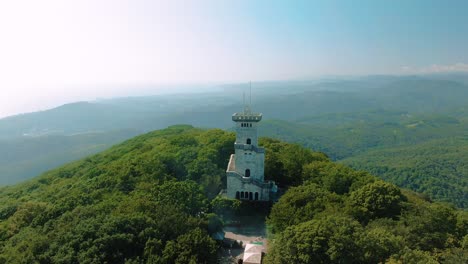 aerial view of a mountaintop tower with forest