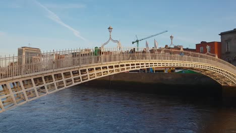 most famous bridge in dublin - the ha'penny bridge over river liffey