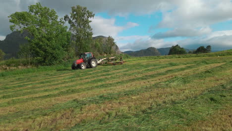 Farmer-plowing-his-farmland-using-a-tractor--Rogaland,-Norway--Wide