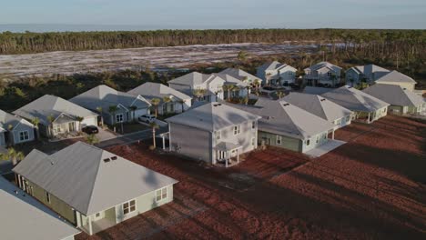 aerial flight over a residential neighborhood in florida at sunset